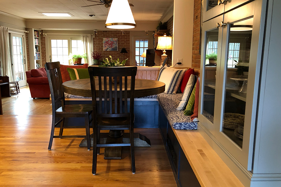 A cozy dining room with a wooden table and chairs