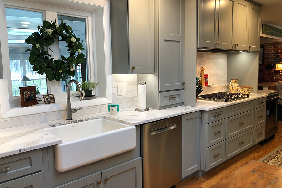 Sleek gray cabinet and white countertop kitchen in Columbia, MD